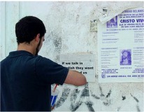 Armando Miguelez. Pegando sobre un muro de San Andr&eacute;s Cholula. PUEBLA, "If we talk in English they wont understand us"